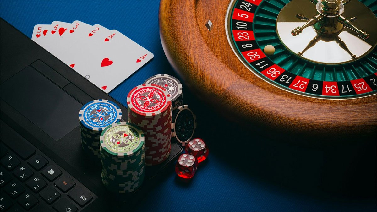 A roulette wheel, betting chips and cards